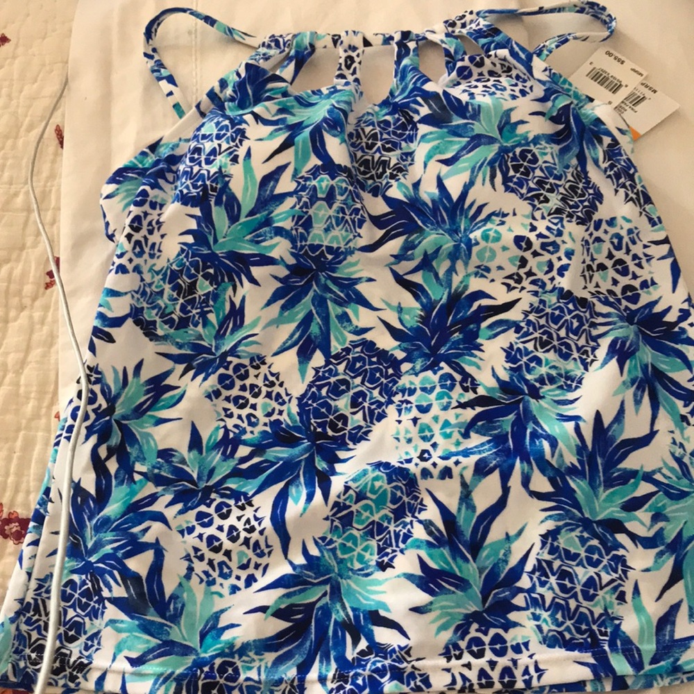 Swimwear top. Blue and white tropical print